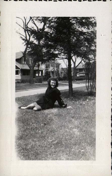 Photograph, Irene Conole sitting on grass